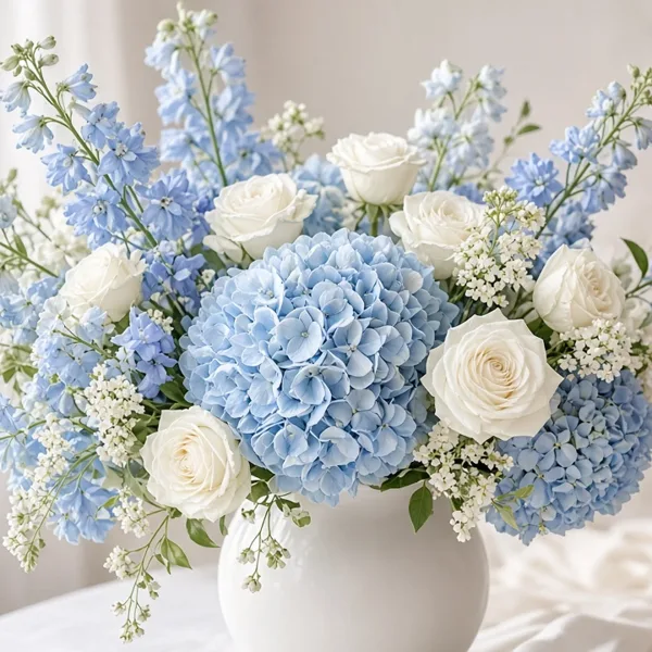 Baby blue artificial flowers styled for a wedding table